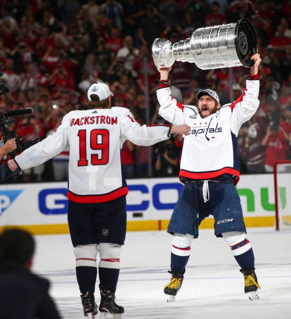 Washington Capitals left wing Alex Ovechkin (8) and center Nicklas Backstrom (19) celebrates af ...