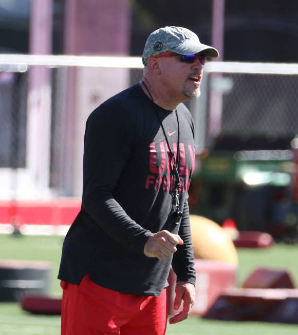 UNLV Rebels head coach Tony Sanchez instructs his players during team practice on Tuesday, Aug. ...