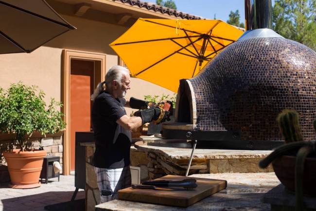 Hubert Keller, chef of Fleur de Lys and Fleur, prepares his Forno Piombo wood burning oven in h ...