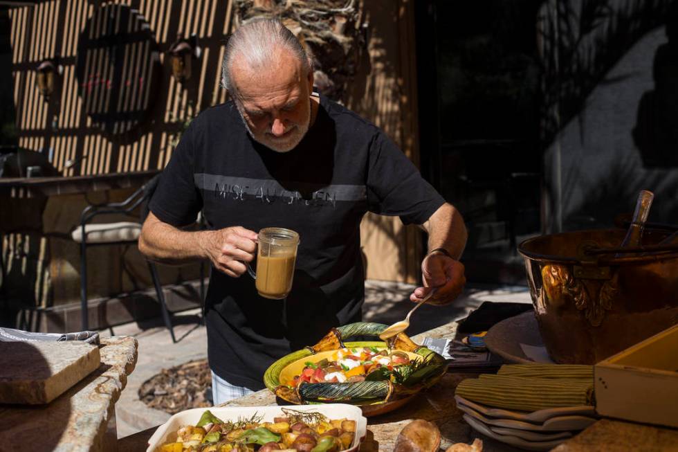 Hubert Keller, chef of Fleur de Lys and Fleur, dresses a tomato salad in his backyard kitchen i ...