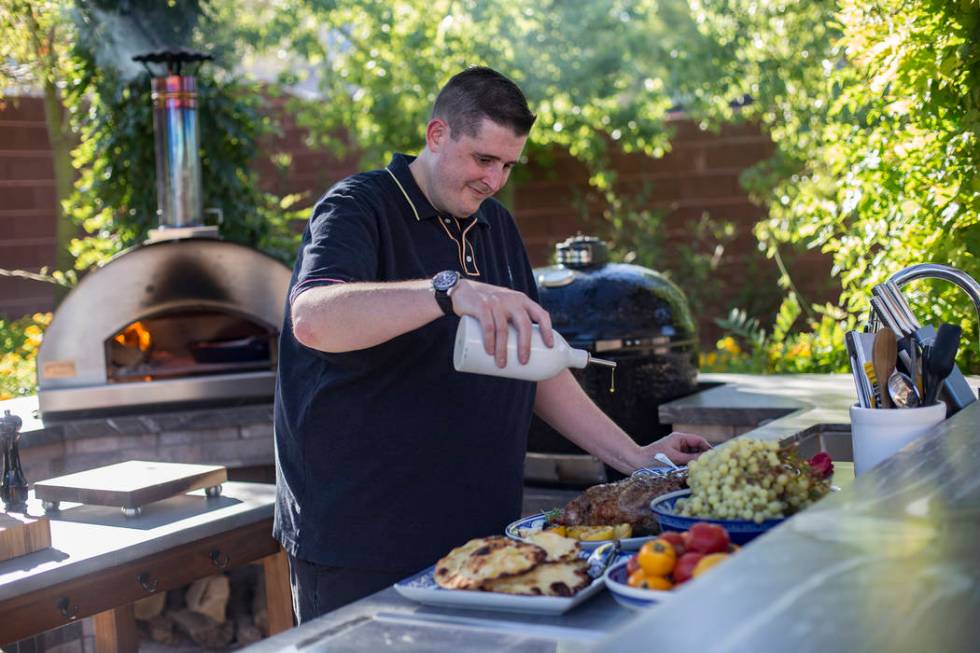 Matt Silverman, chef for HEXX Kitchen + Bar, prepares food in his backyard kitchen in Las Vegas ...