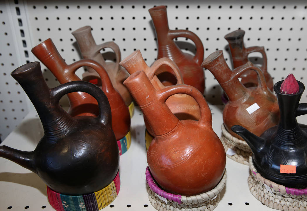 Ethiopian traditional clay coffee pots are displayed at Melkam Market, an Ethiopian store, on T ...