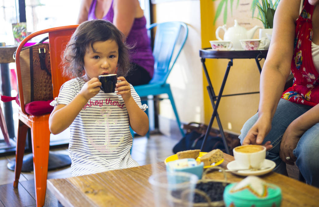 Lyla, 4, of Las Vegas, enjoys a drink at Java Tree at Flamingo Road and Decatur Boulevard in La ...