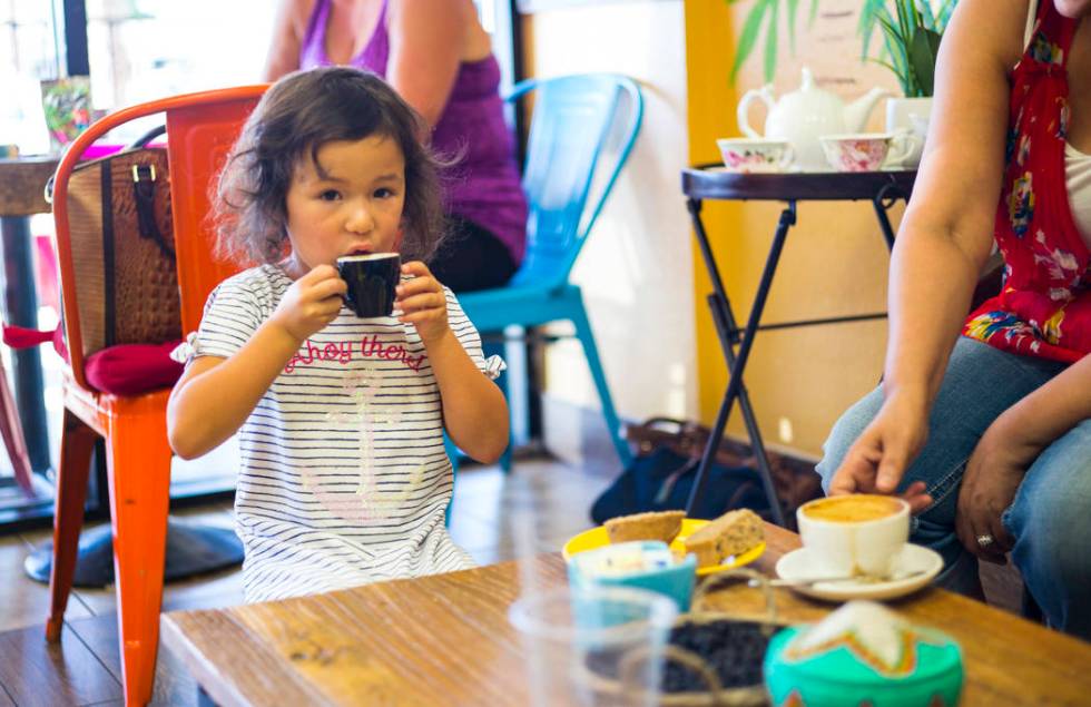 Lyla, 4, of Las Vegas, enjoys a drink at Java Tree at Flamingo Road and Decatur Boulevard in La ...