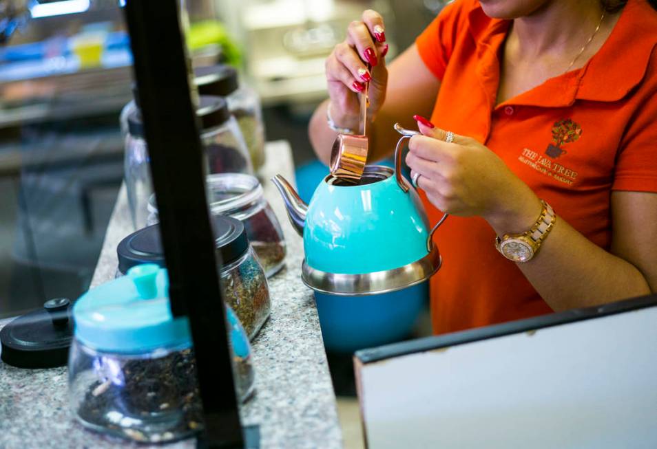 Gio Marongiu, store manager at Java Tree, prepares tea at the store at Flamingo Road and Decatu ...