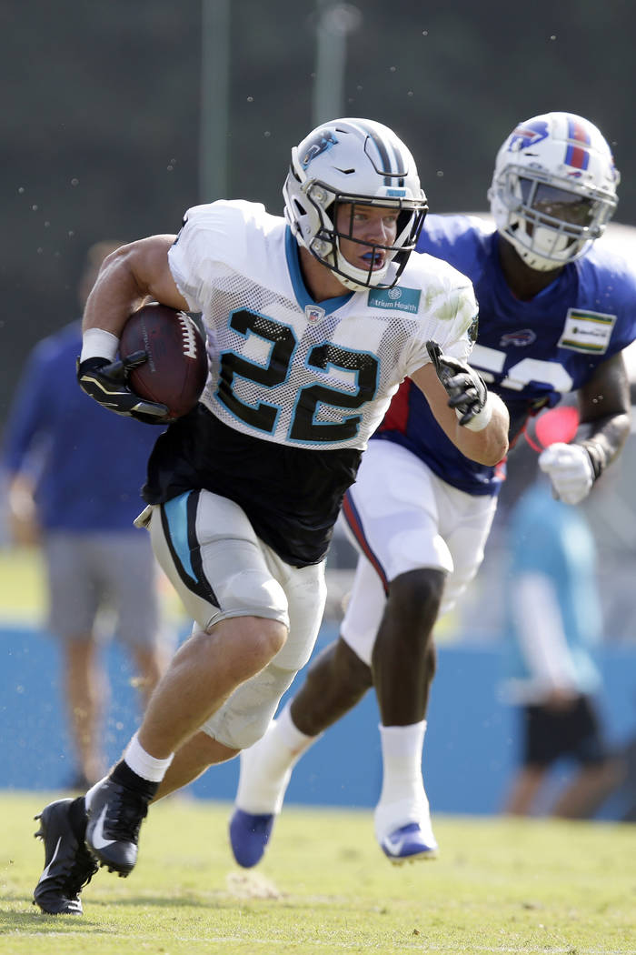 Carolina Panthers' Christian McCaffrey (22) runs the ball during an NFL football training camp ...