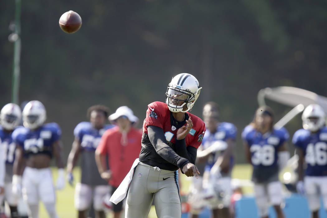 Carolina Panthers quarterback Cam Newton passes during an NFL football training camp with the B ...