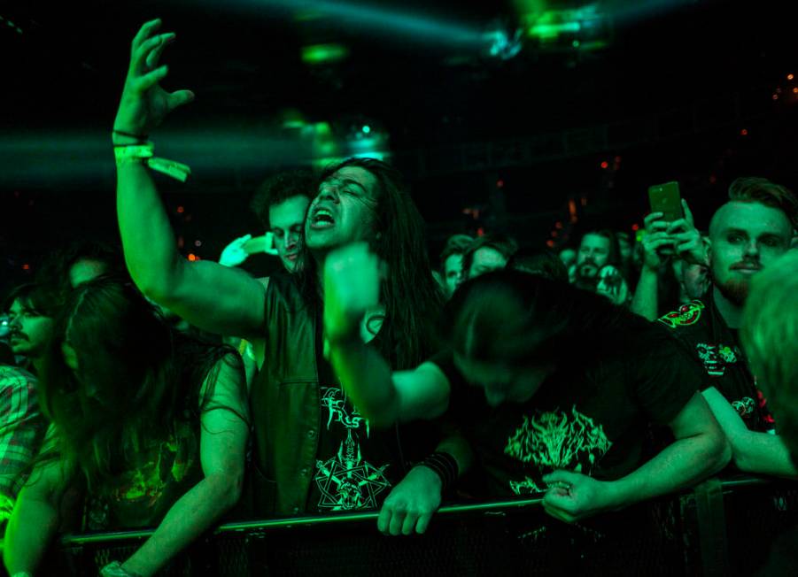 Fans react as Triumph of Death performs at the Mandalay Bay Events Center during the Psycho Las ...