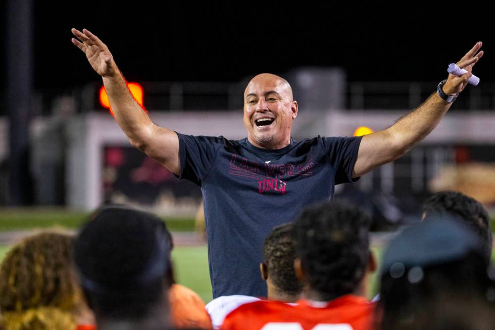 Head coach Tony Sanchez pumps up his players as the season nears following the UNLV football te ...