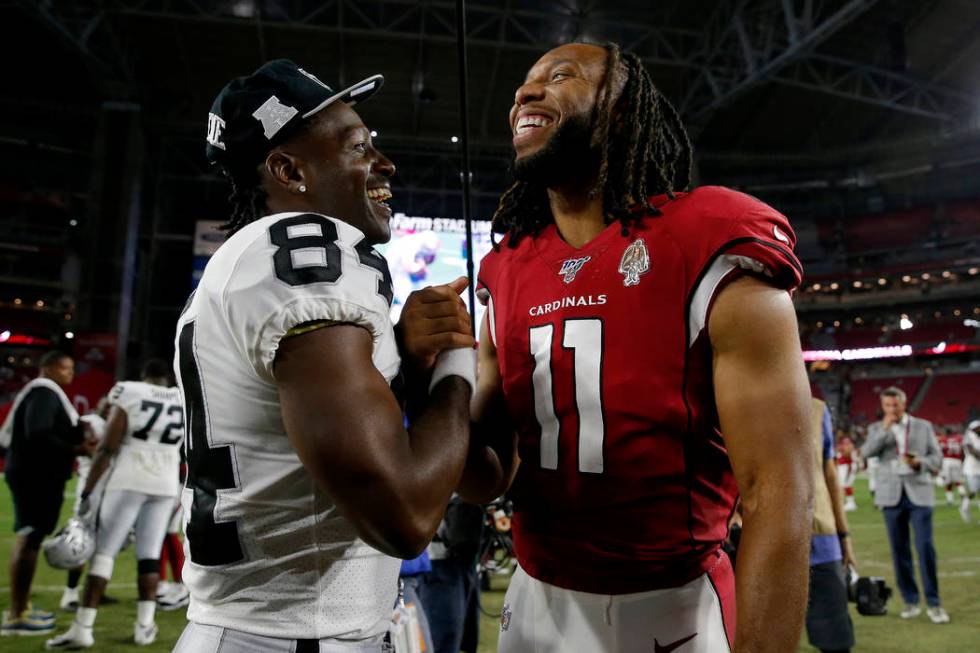 Oakland Raiders wide receiver Antonio Brown (84) and Arizona Cardinals wide receiver Larry Fitz ...