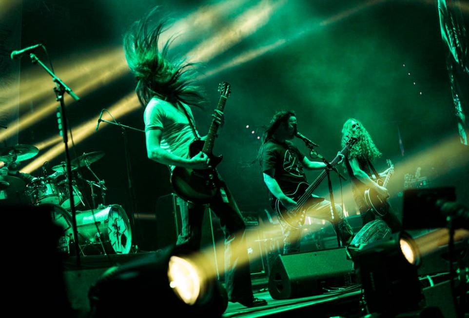 Bill Steer, from left, Jeff Walker, and Tom Draper, of Carcass, perform at the Mandalay Bay Eve ...