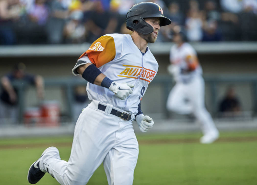 Las Vegas Aviators first baseman Seth Brown (9) rounds first base after singling in the bottom ...