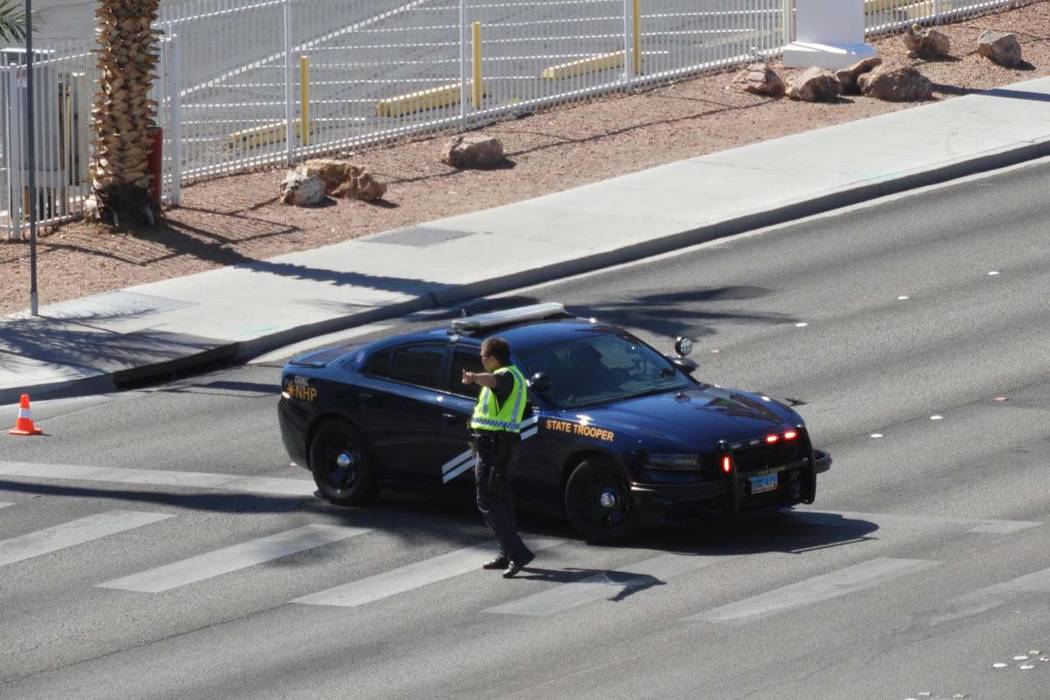 A Nevada Highway Patrol trooper directs traffic near the Aquarius Casino in Laughlin after an o ...