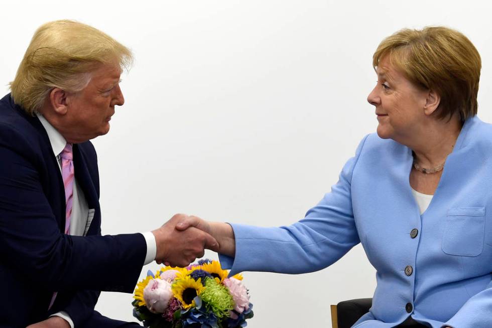 President Donald Trump meets with German Chancellor Angela Merkel on the sidelines of the G-20 ...