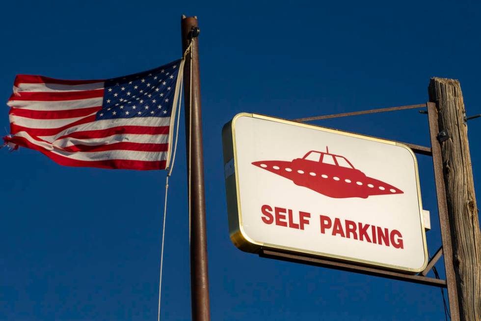 A UFO sign and American flag above the restaurant at the Little A'Le'Inn which is to be a gathe ...