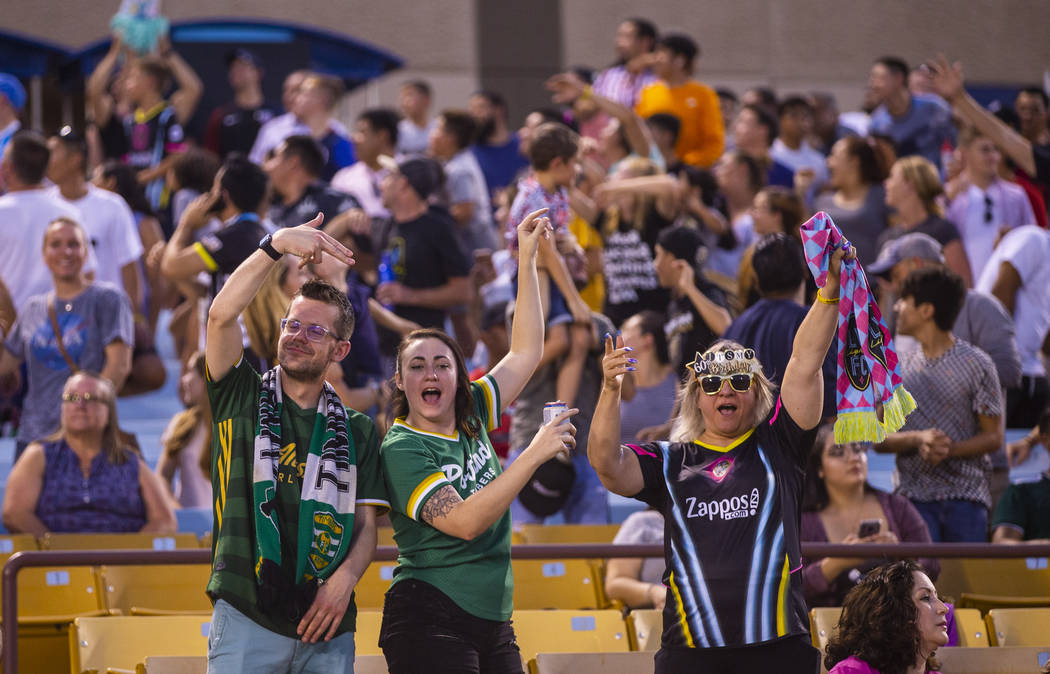 Fans cheer for free merchandise during the Las Vegas Lights FC versus Portland Timbers 2 match ...