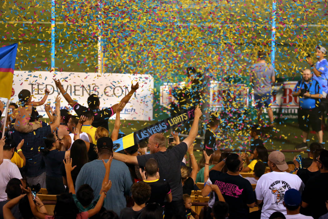 Las Vegas Lights FC fans are bathed in confetti as they celebrate their 1-0 win over Portland T ...