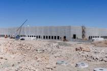 An industrial building, slated to be a future Amazon distribution facility, is under constructi ...