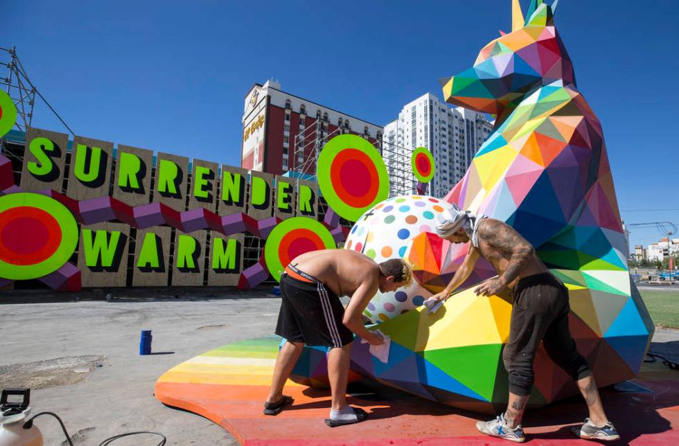 Marcos Martinez, left, and Pablo Hattori, assistants to Spanish street artist Okuda San Miguel, ...