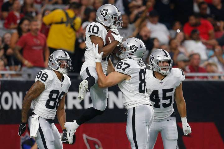 Oakland Raiders wide receiver Rico Gafford (10) celebrates his touchdown against the Arizona Ca ...