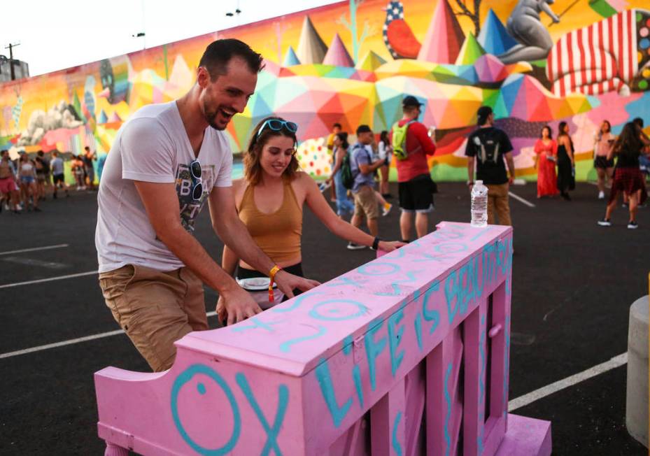 Jordan Maxwell, left, of Las Vegas plays the piano as Aleks Bolta, also of Las Vegas, looks on ...