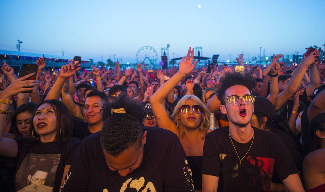 Fans react as French Montana performs at the Downtown stage during the first day of the annual ...