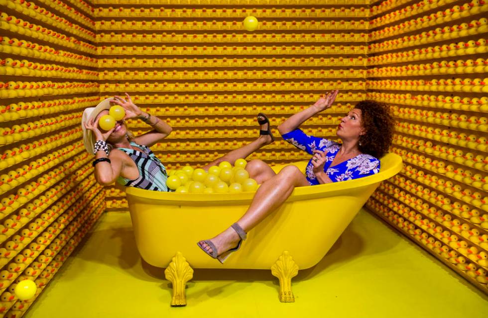 Vanessa Esparza, left, and Tevis Holboron play around in the Bathtub of Fun at the new Happy Pl ...