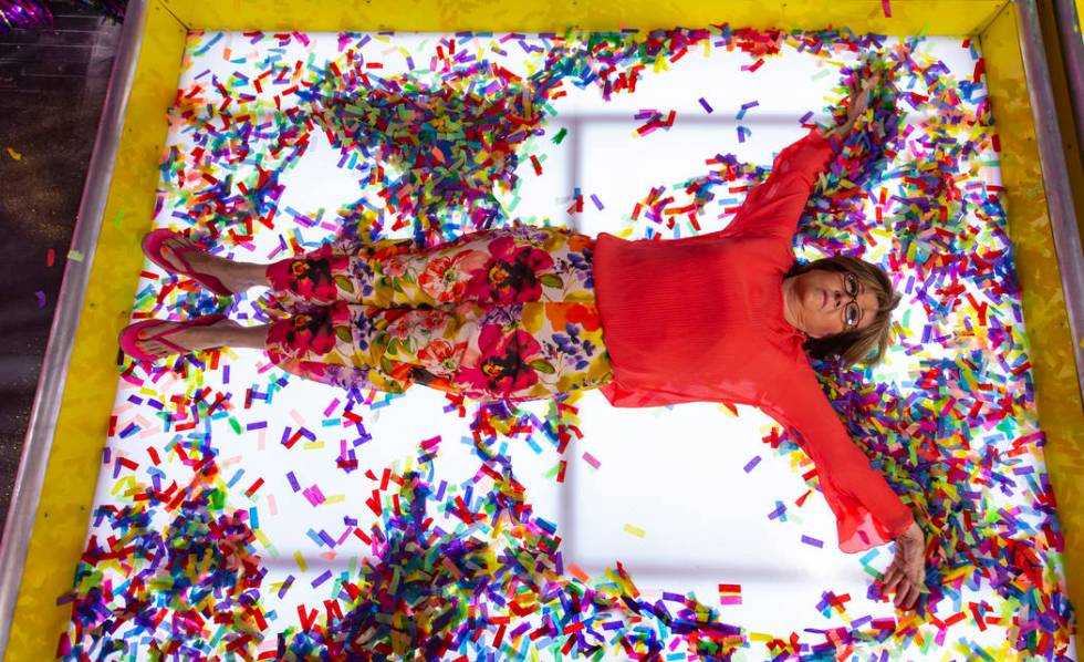Debbie Kaye lays down and makes a confetti angel while in the Confetti Angels Room at the new H ...