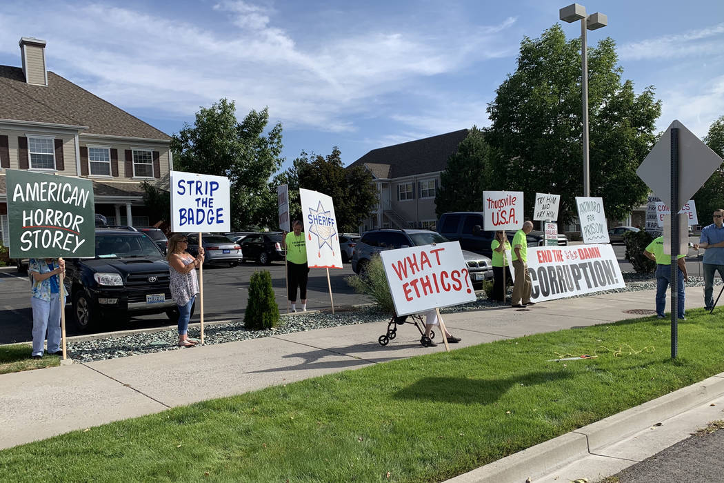 Protesters opposing a state Board of Ethics decision to dismiss two complaints against Storey C ...