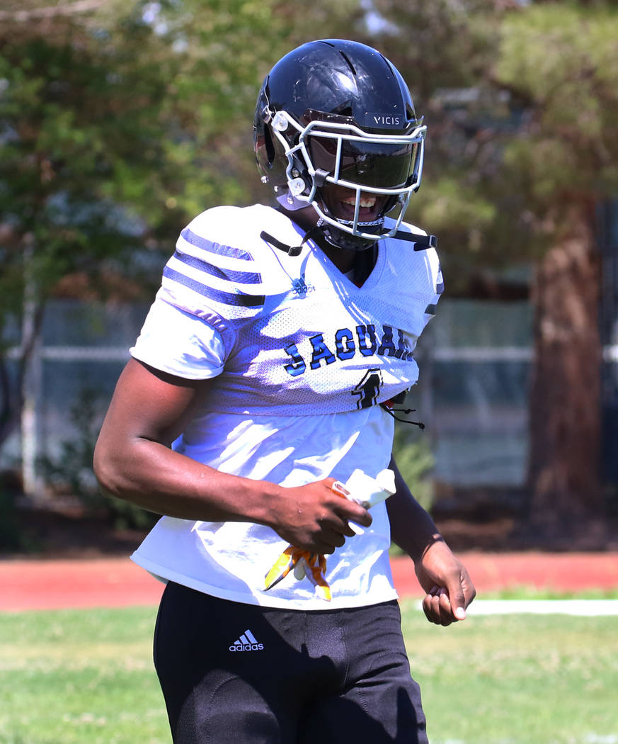 Desert Pines High School defensive lineman Darnell Washington (1) takes the field during team p ...