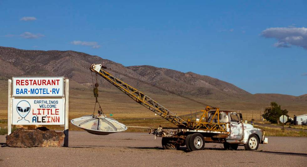 A spaceship hanging from a tow truck marks the entrance to the Little A'Le'Inn on Aug. 1, 2019, ...