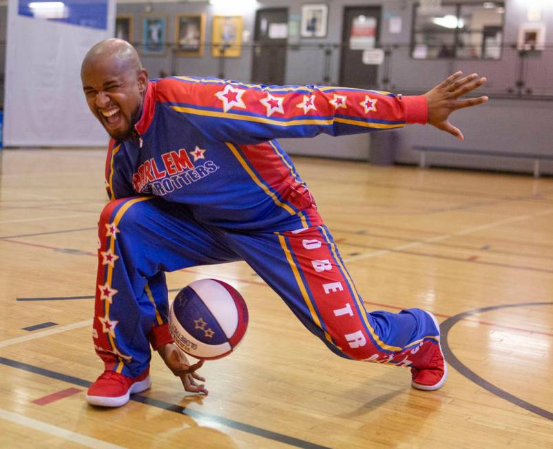 Las Vegas resident and Harlem Globetrotter Scooter Christensen demonstrates tricks at the Dula ...