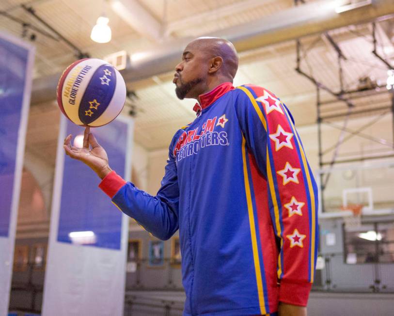 Las Vegas resident and Harlem Globetrotter Scooter Christensen demonstrates tricks at the Dula ...