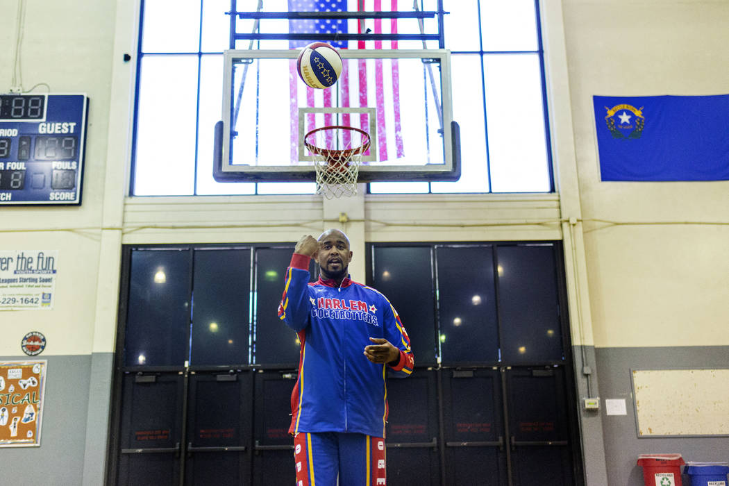 Las Vegas resident and Harlem Globetrotter Scooter Christensen demonstrates tricks at the Dula ...