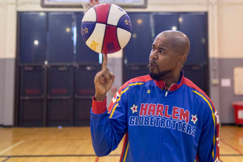 Las Vegas resident and Harlem Globetrotter Scooter Christensen demonstrates tricks at the Dula ...