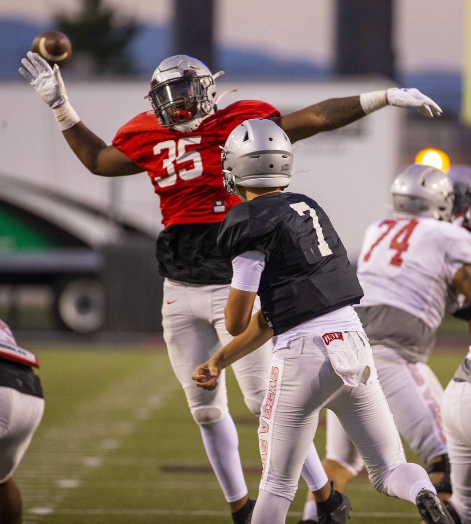 Jacoby Windmon (35) nearly deflects a pass from QB Kenyon Oblad (7) during the UNLV football te ...