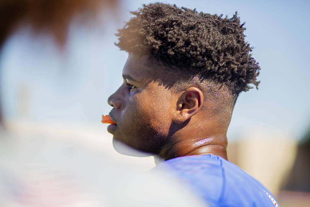 Bishop Gorman's outside linebacker Bryan Certain (24) watches a scrimmage during practice at Bi ...