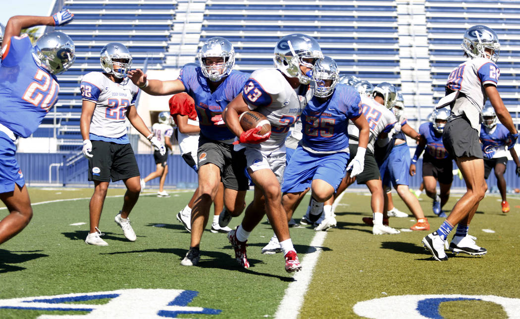 Bishop Gorman's running back Jahsai Shannon (33) completes a drill during practice at Bishop Go ...