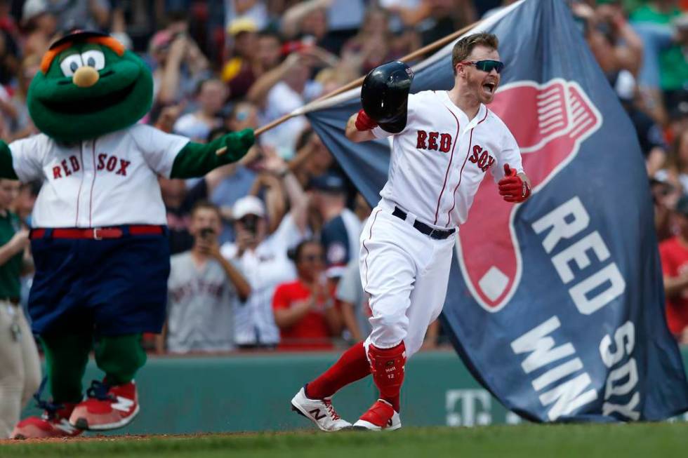 Boston Red Sox's Brock Holt celebrates his game-winning RBI single during the 10th inning of a ...