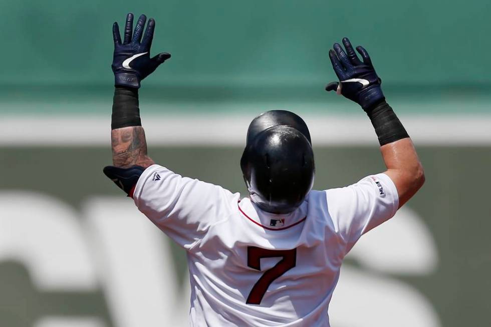 Boston Red Sox's Christian Vazquez celebrates his double during the 10th inning of a baseball g ...