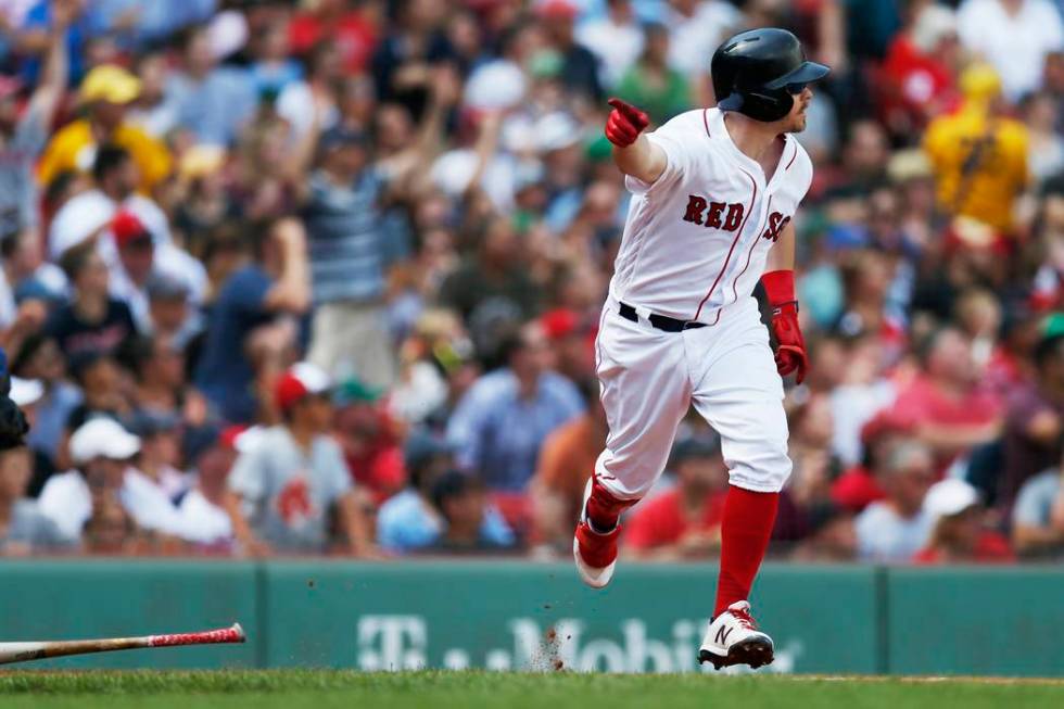 Boston Red Sox's Brock Holt runs on his game-winning RBI single during the 10th inning of a bas ...