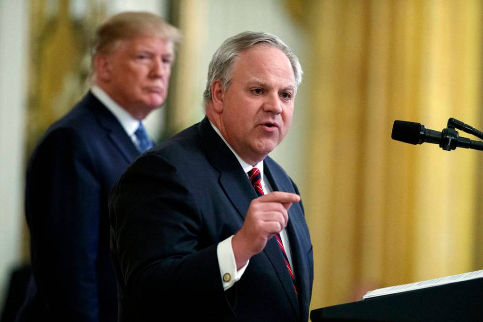 In this July 8, 2019 file photo President Donald Trump listens as Secretary of the Interior Dav ...