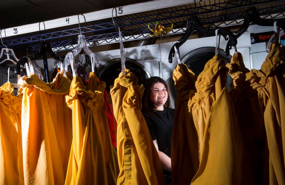 Tyler Cecchini, a crafts technician for Cirque du Soleil's "O," stands among costumes at the Be ...