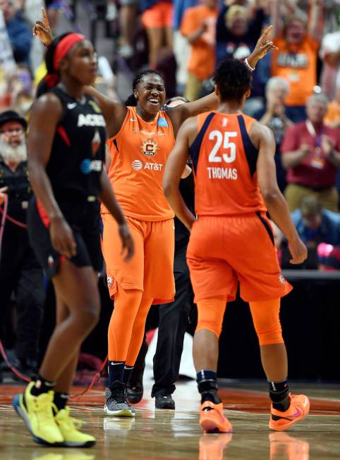 Connecticut Sun forward Shekinna Stricklen, center, celebrates with Alyssa Thomas, right, as La ...