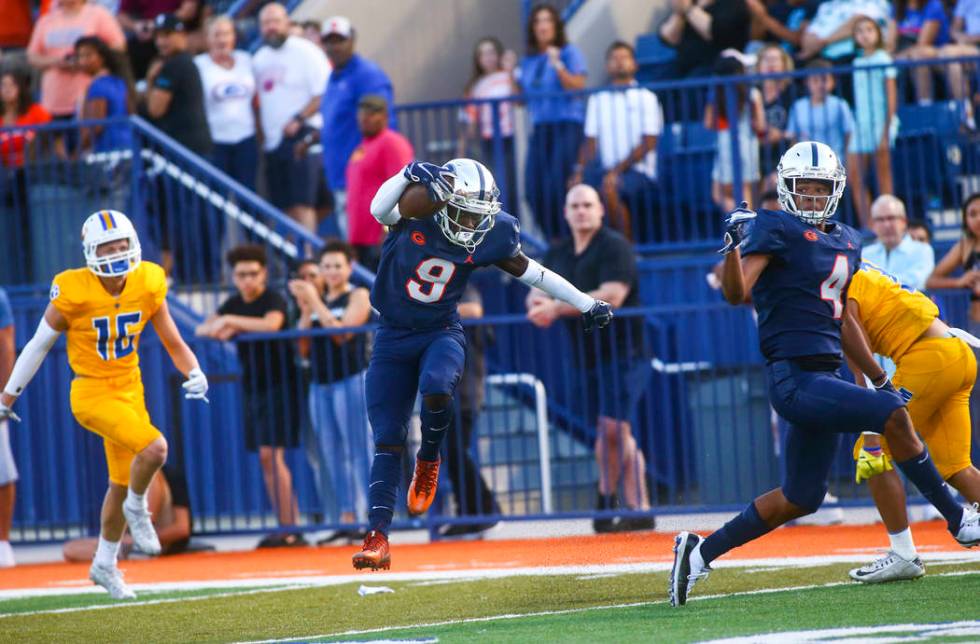 Bishop Gorman's Zachariah Branch (9) makes his way to the end zone to score a touchdown against ...