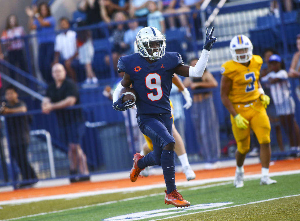 Bishop Gorman's Zachariah Branch (9) celebrates a touchdown against Orem during the first half ...