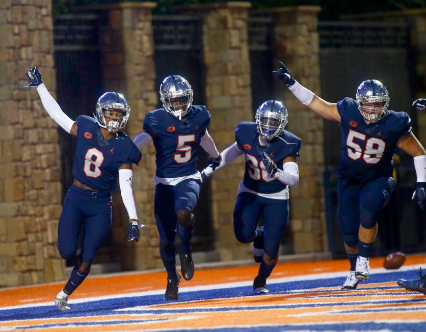 Bishop Gorman's Fabian Ross (8) celebrates his touchdown with teammates during the first half o ...