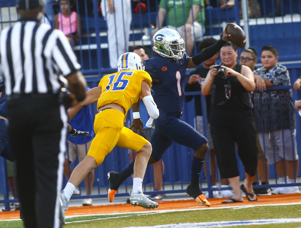 Bishop Gorman's Micah Bowens (1) is forced out of bounds by Orem's Brody Monson (16) near the e ...