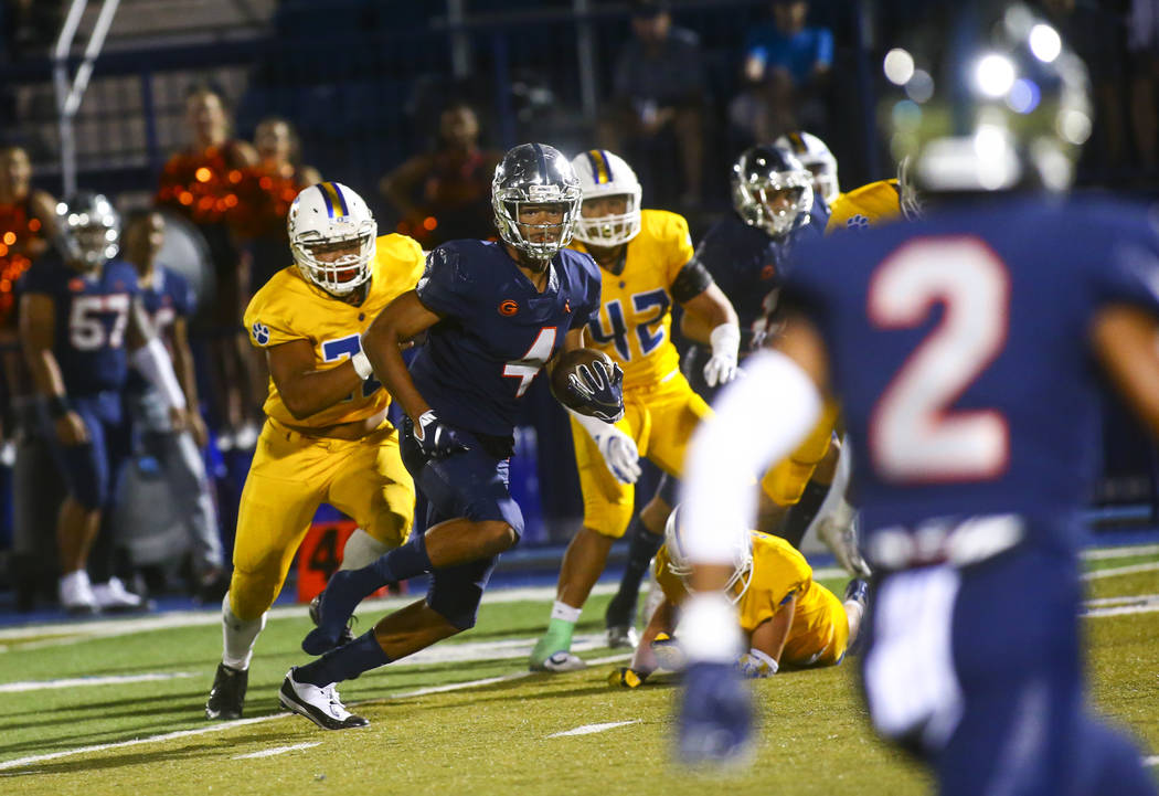 Bishop Gorman's Rome Odunze (4) runs the ball against Orem during the second half of a football ...