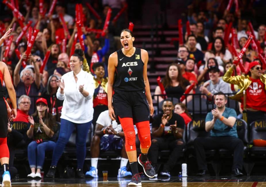 Las Vegas Aces' Liz Cambage celebrates during the second half of a WNBA basketball game against ...